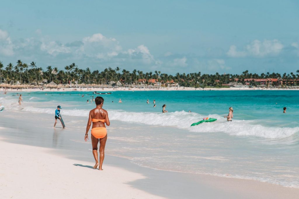 Relaxing beach scene in Punta Cana with clear skies and turquoise waters.