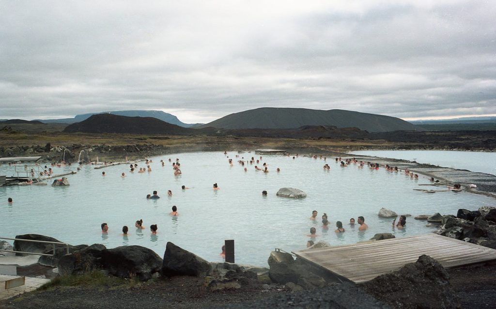People enjoying relaxation in a natural geothermal spa in Reykjavík, Iceland.